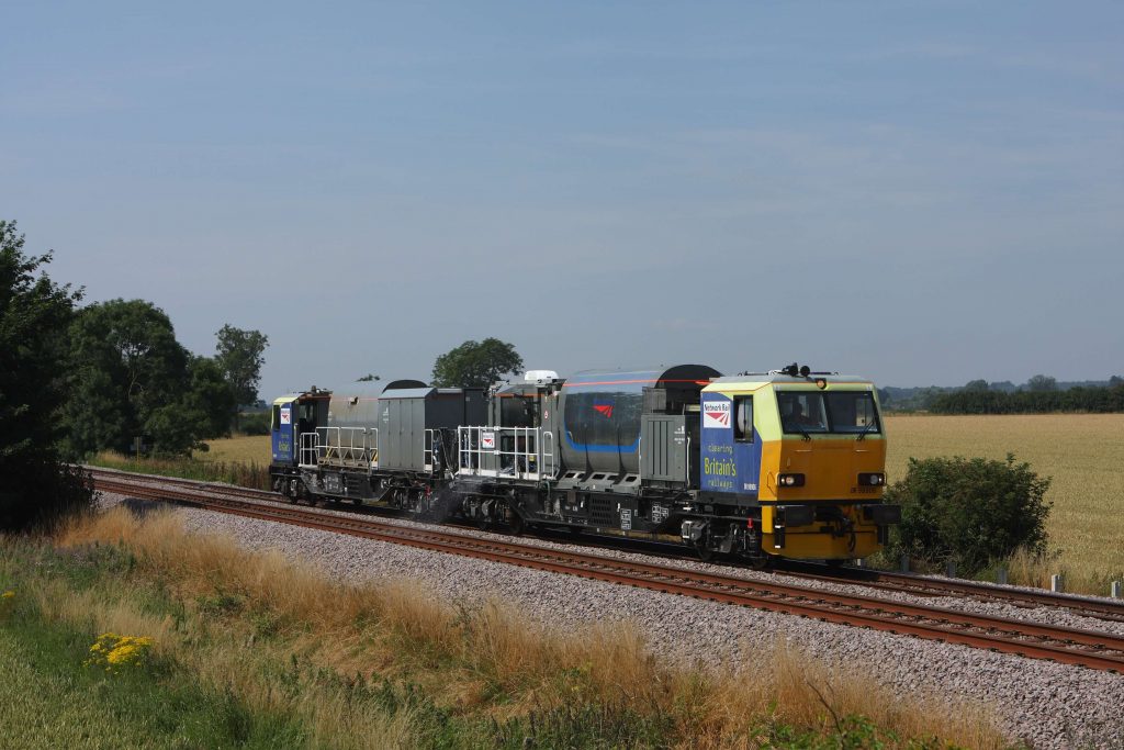 A multipurpose vehicle on the railway with weed spraying tanks attached